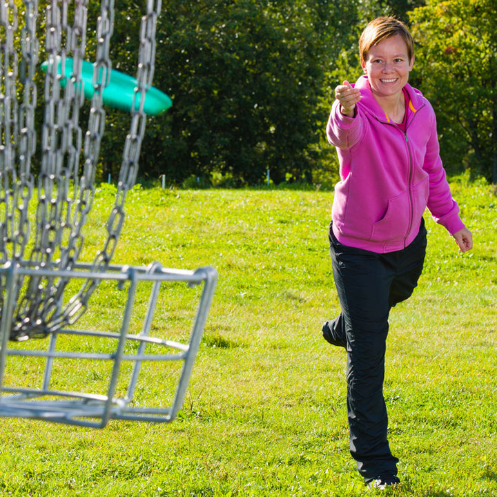Woman outside on nice sunny day throwing a frisbee 