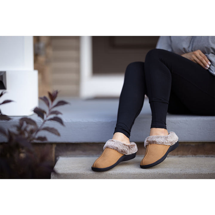 PowerStep Orthotic Arch Supporting clog slippers for Women, woman wearing arch supporting orthotic slippers outside 